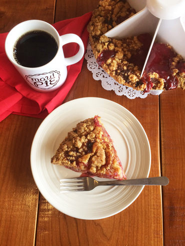 Cherry Pie sliced with Maui Pie mug